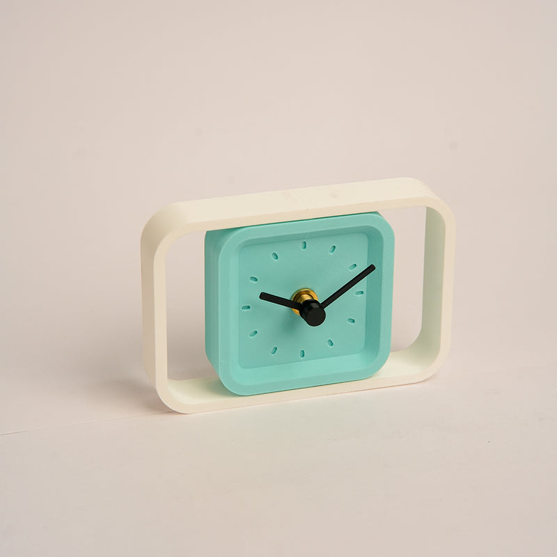 LayerStory SpinFrame Rotating Desk Clock with teal dial and white frame
