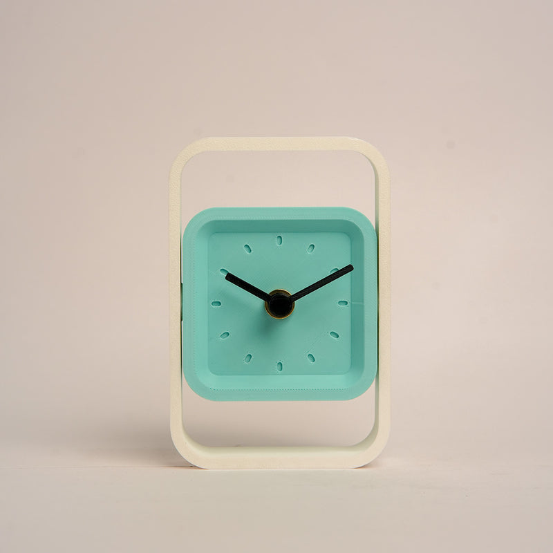 Compact SpinFrame teal and white desk clock for stylish interiors
