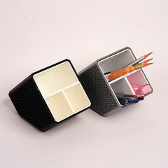 Stylish angled desk organizer with four compartments, holding colorful pens and markers, ideal for office or home workspace organization.