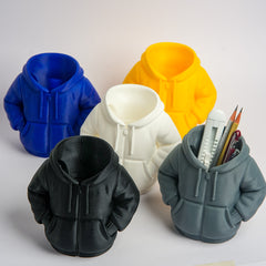 Five silicone hoodie-shaped molds in different colors with a gray mold containing pens.