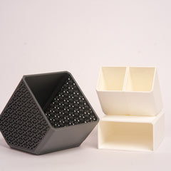 Stylish angled desk organizer with four compartments, holding colorful pens and markers, ideal for office or home workspace organization.